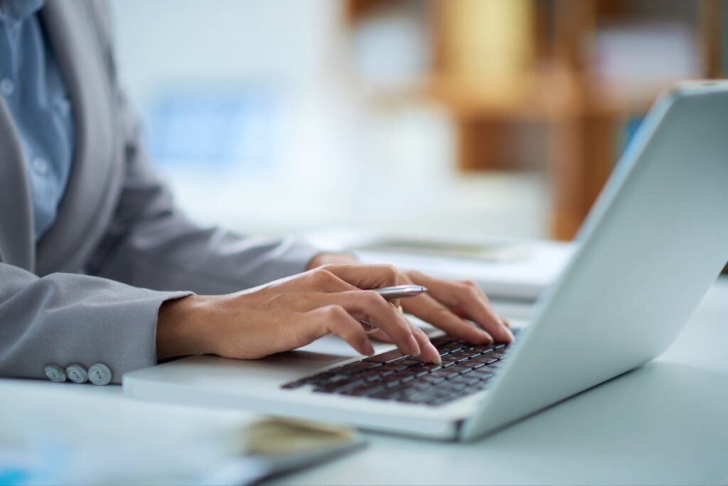 Close up of woman working on her laptop